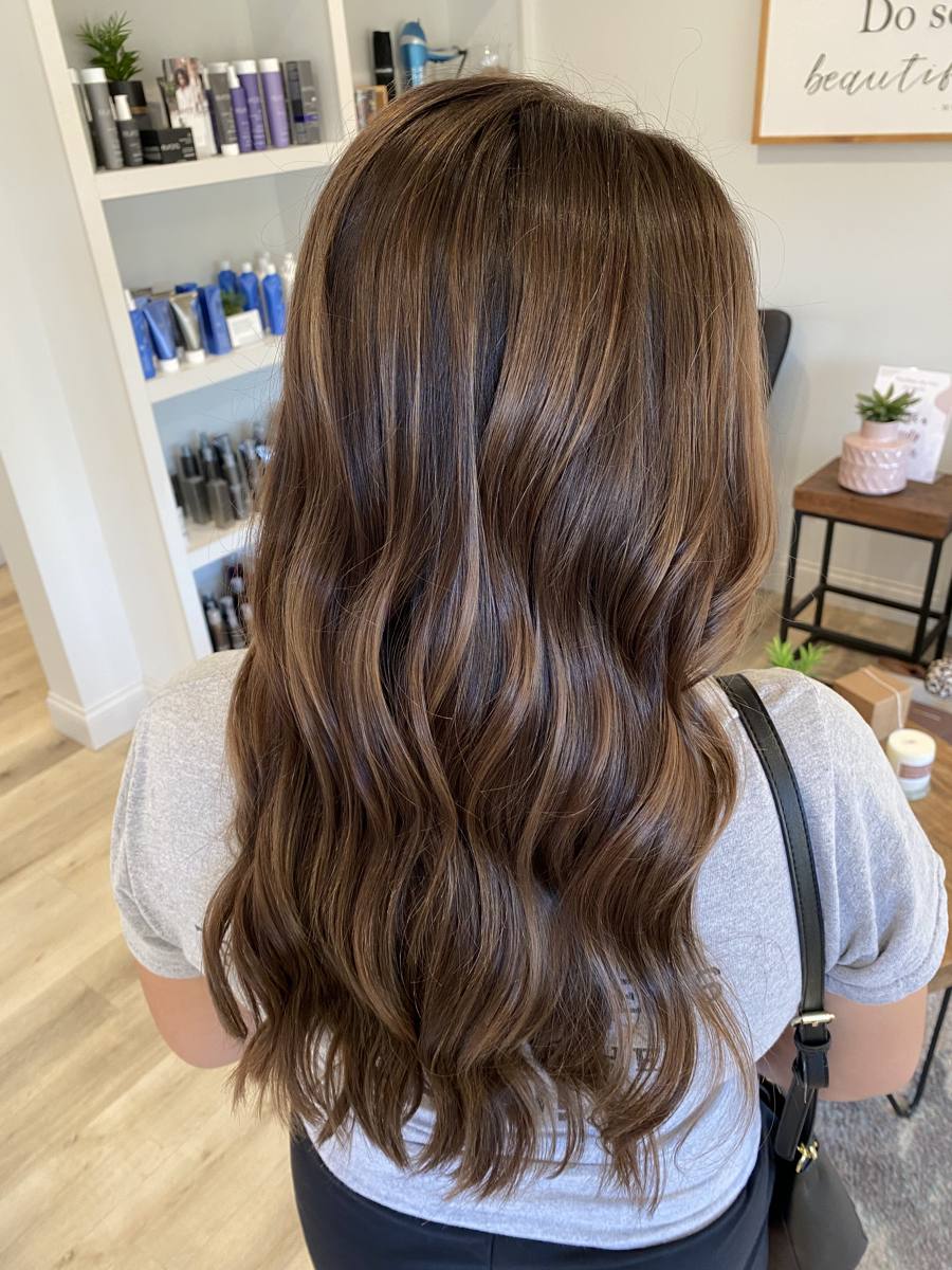 Warm brown balayage with soft curls
