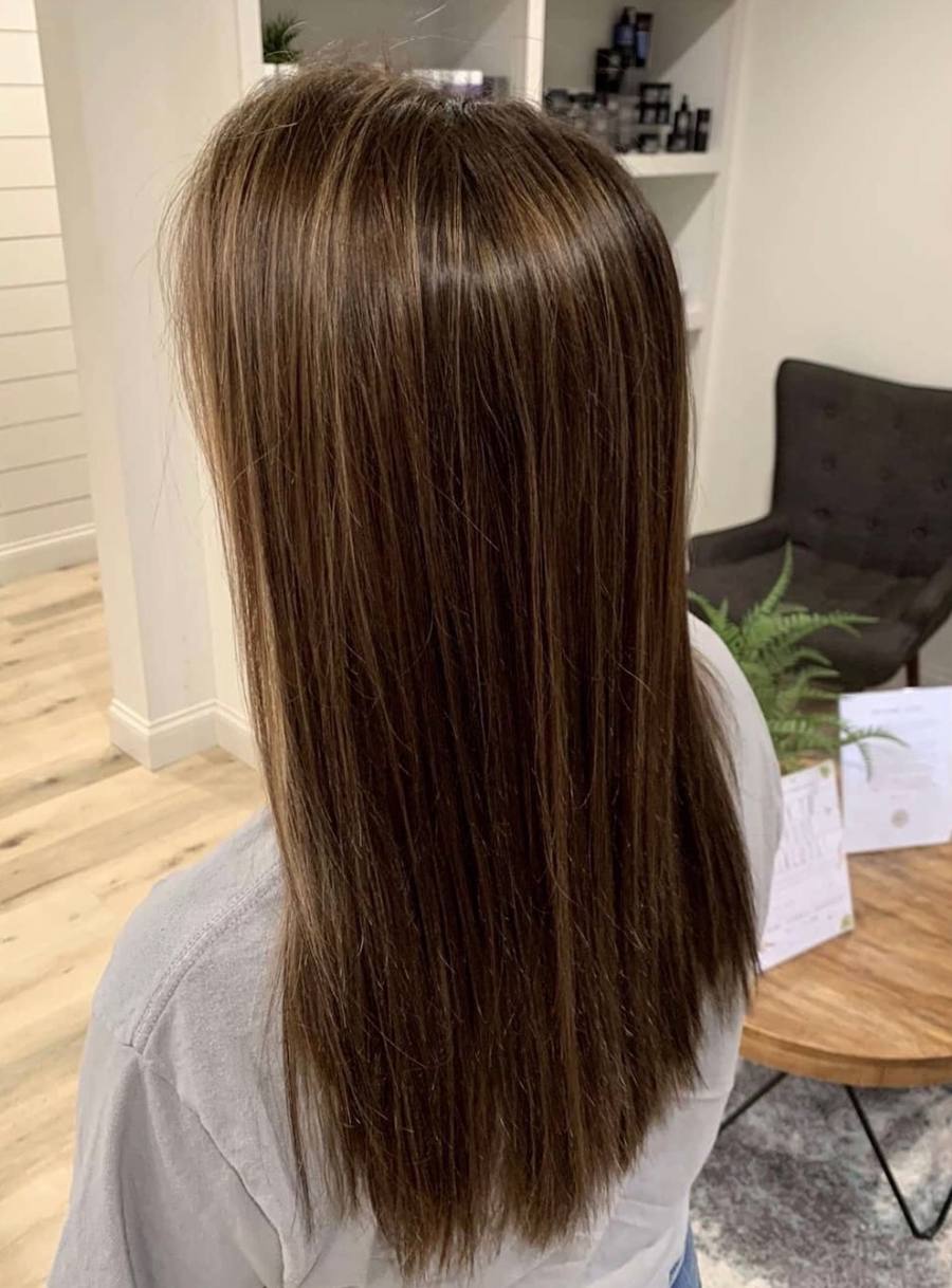 Sleek straight brunette with subtle highlights